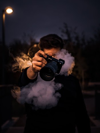 Man Holding A Camera
