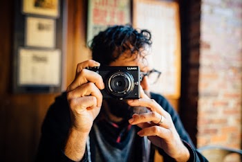 Man Holding a Camera 