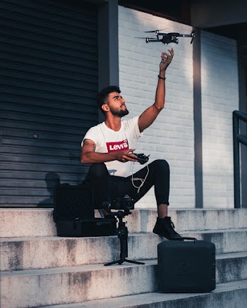 Man Holding a Drone Controller