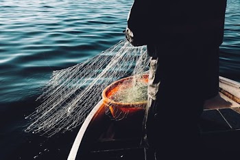 man holding a fishnet