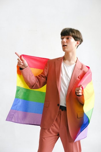 Man Holding a Gay Pride Flag