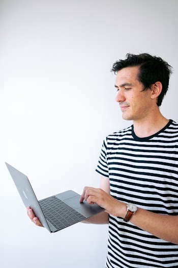 Man Holding A Laptop