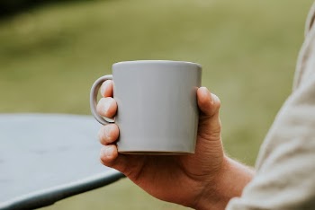 Man holding a white mug | Free Photo - rawpixel