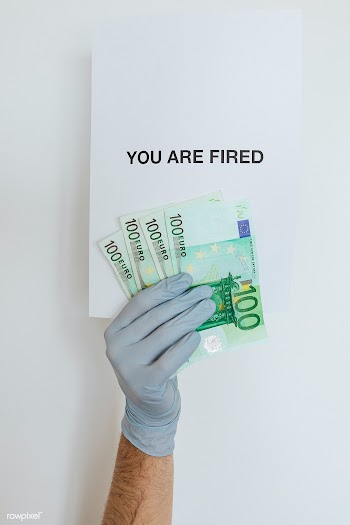Man holding a you are fired note during the COVID-19 pandemic | Free  photo - 2350875