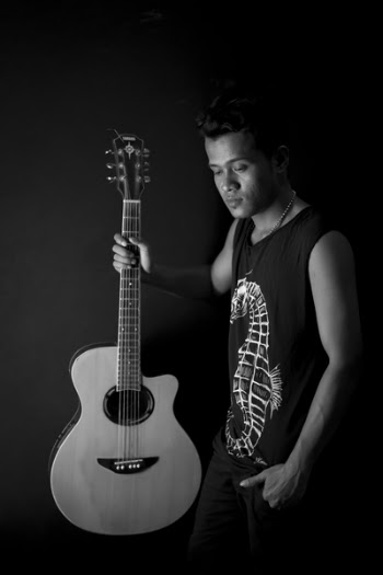 Man Holding Acoustic Guitar
