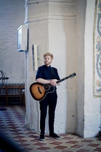 Man Holding Acoustic Guitar