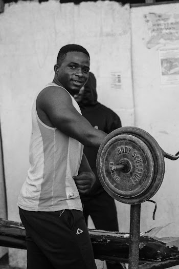 Man Holding Barbell