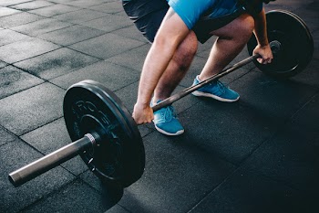 Man Holding Barbell