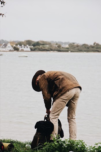 Man Holding Black Bag