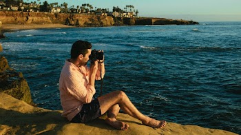 Man Holding Black Camera