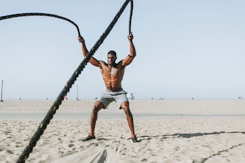 man holding black ropes during daytime