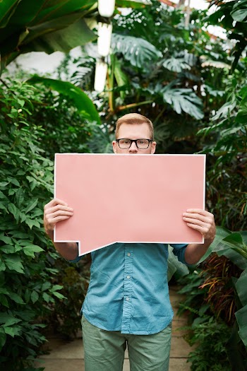 Man Holding Blank Signboard