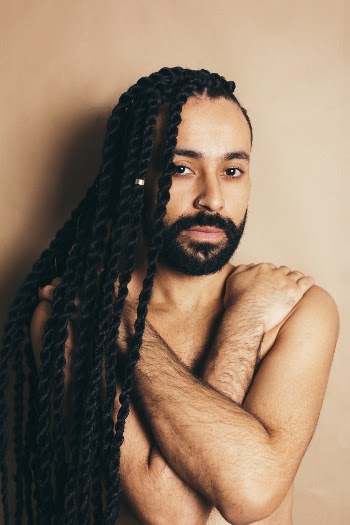 Man Holding Both Shoulders With Both Hands