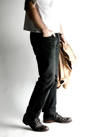 man holding brown blazer
