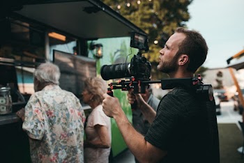 Man Holding Camera Outdoor Watching Above