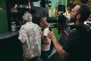 Man Holding Camera With Stabilizer