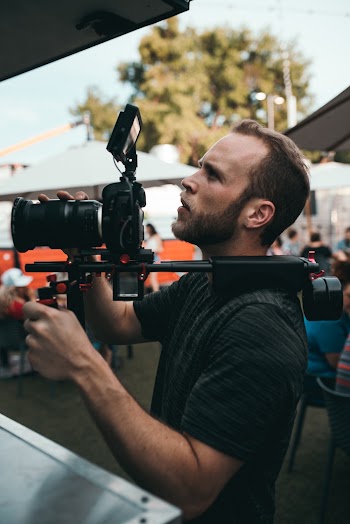 Man Holding Camera With Stabilizer