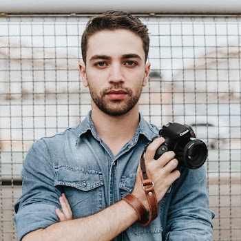 Man Holding Canon Camera