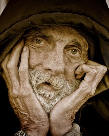 Man Holding Chin Close-up Photography