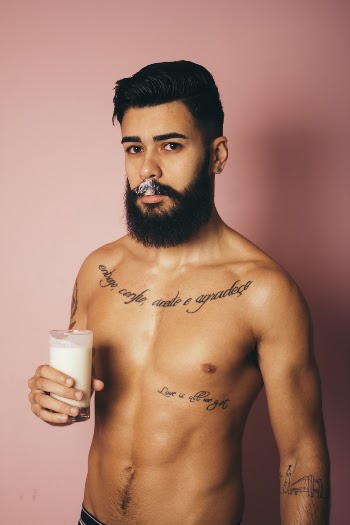 Man Holding Clear Drinking Glass 
