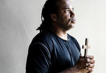 Man Holding Cross