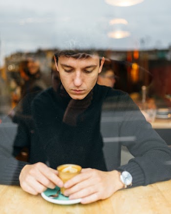 Man Holding Cup