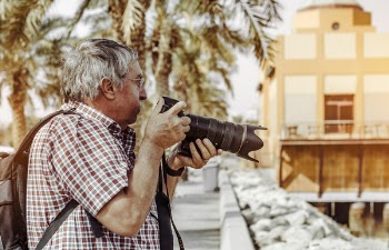 Man Holding Dslr Camera