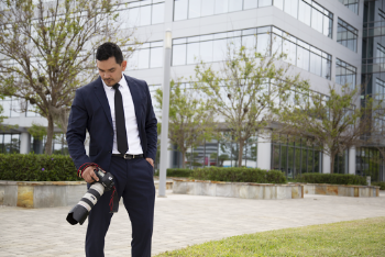 Man Holding Dslr Camera