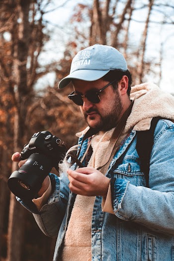 Man Holding Dslr Camera