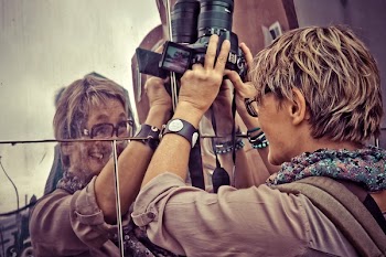 Man Holding Dslr Camera