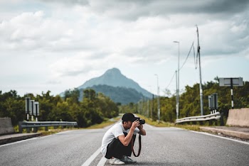 Man Holding Dslr Camera