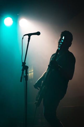 man holding electric guitar