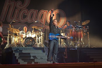 Man Holding Electric Guitar on Stage