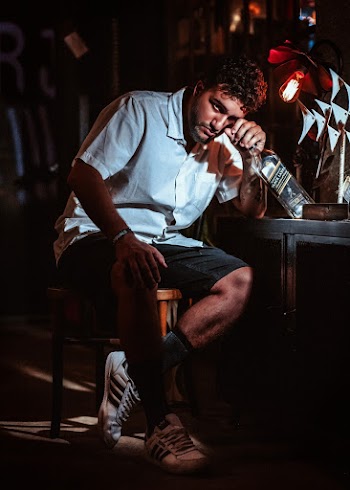 Man Holding Empty Bottle
