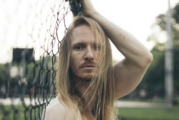 Man Holding Fence Close-up Photography