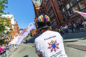 Man holding flag in parade, | Free Photo - rawpixel