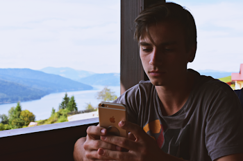 Man Holding Gold Iphone 6