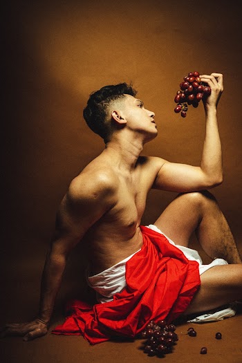 Man Holding Grapes