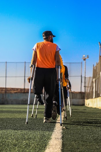 Man Holding Gray Walking Cane
