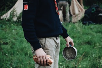 Man Holding Grey Pot
