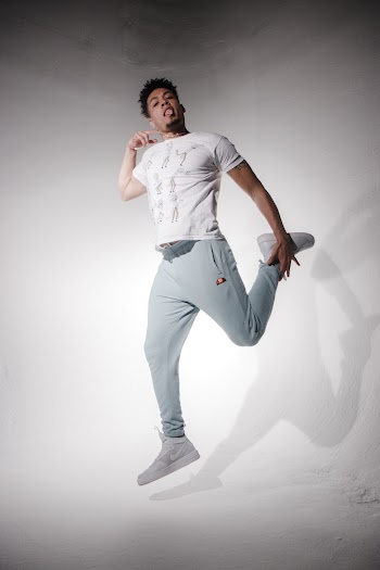 Man Holding His Ankle