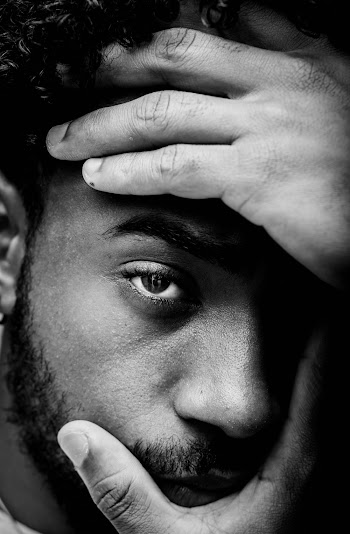 Man Holding His Face