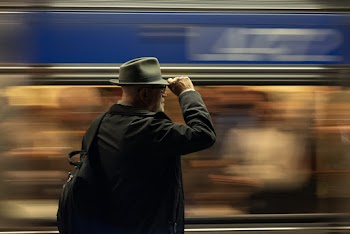 Man Holding His Hat