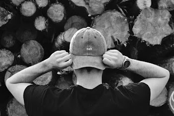 Man Holding His Hat