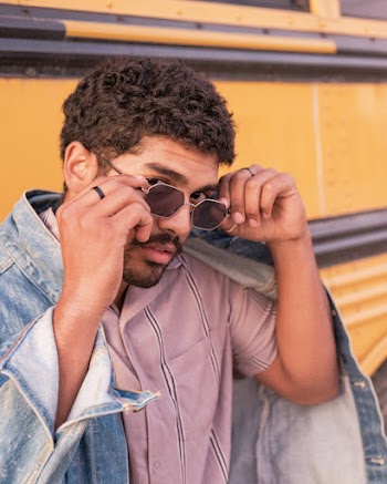 Man Holding His Sunglasses