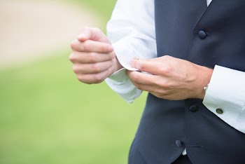 Man Holding His White Long-sleeved Shirt