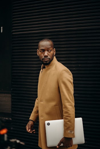 Man Holding Laptop Computer