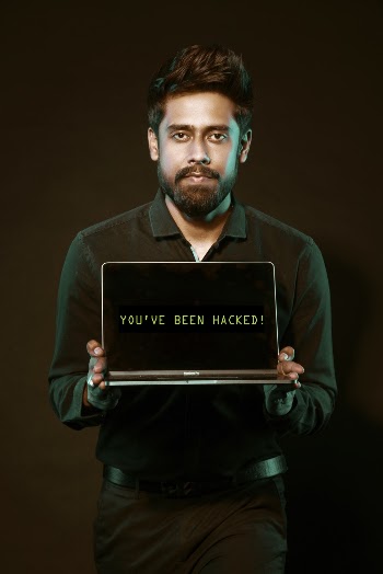 Man Holding Laptop Computer With Both Hands