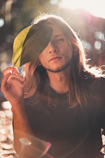 Man Holding Leaf