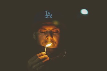 man holding match stick